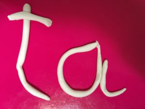 Ta spelled out in play doh