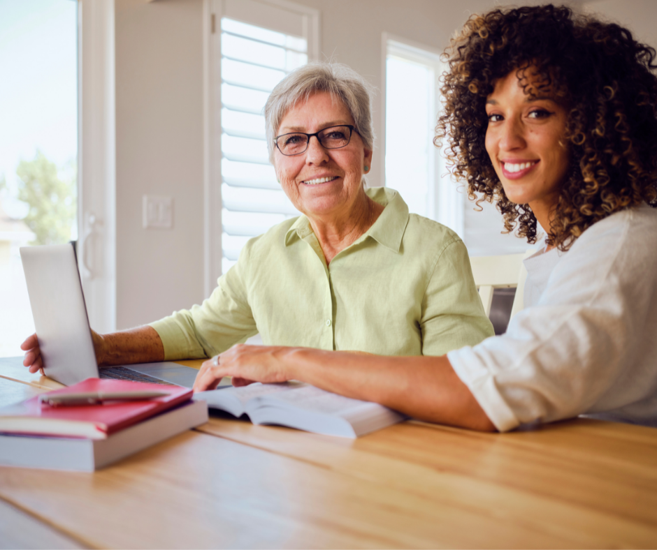     Two females working together at a desk