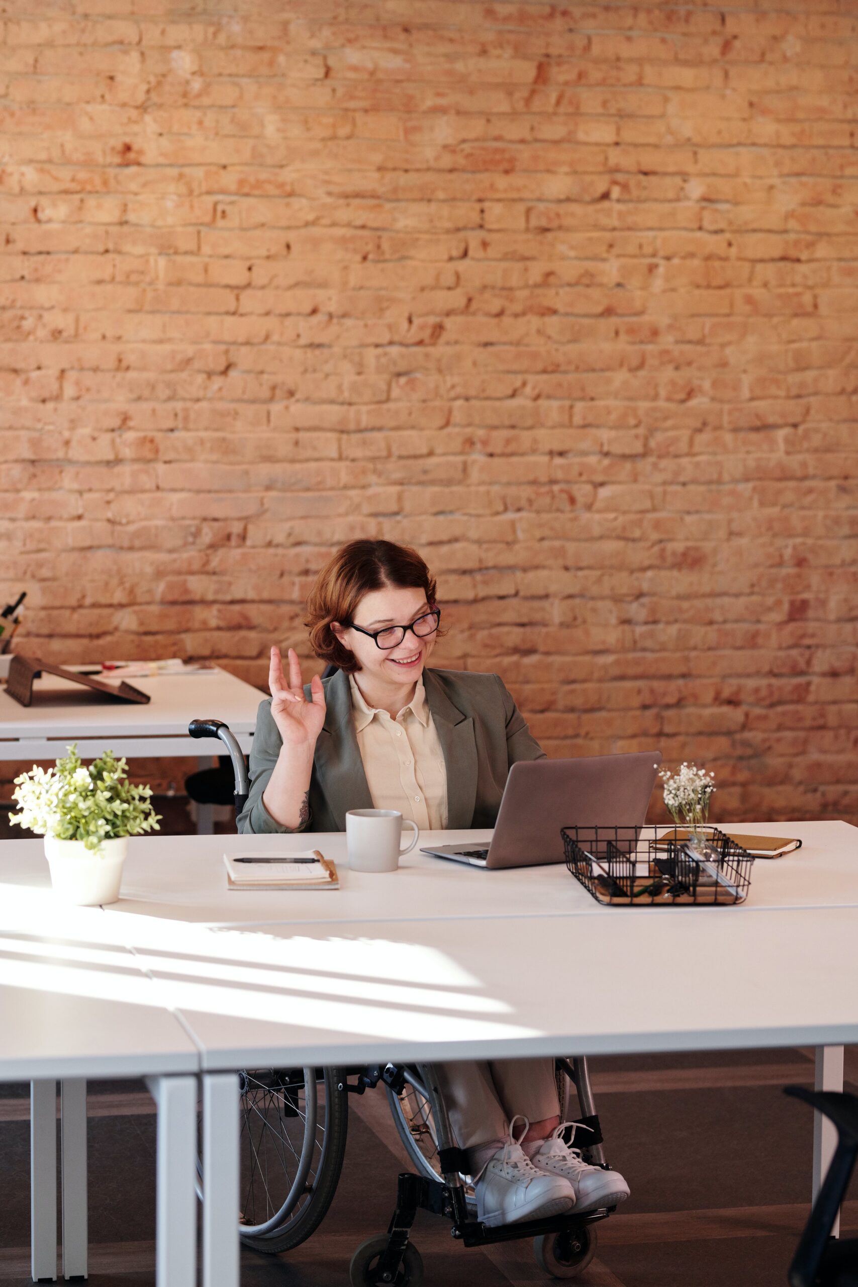     Wheelchair user sitting at a desk