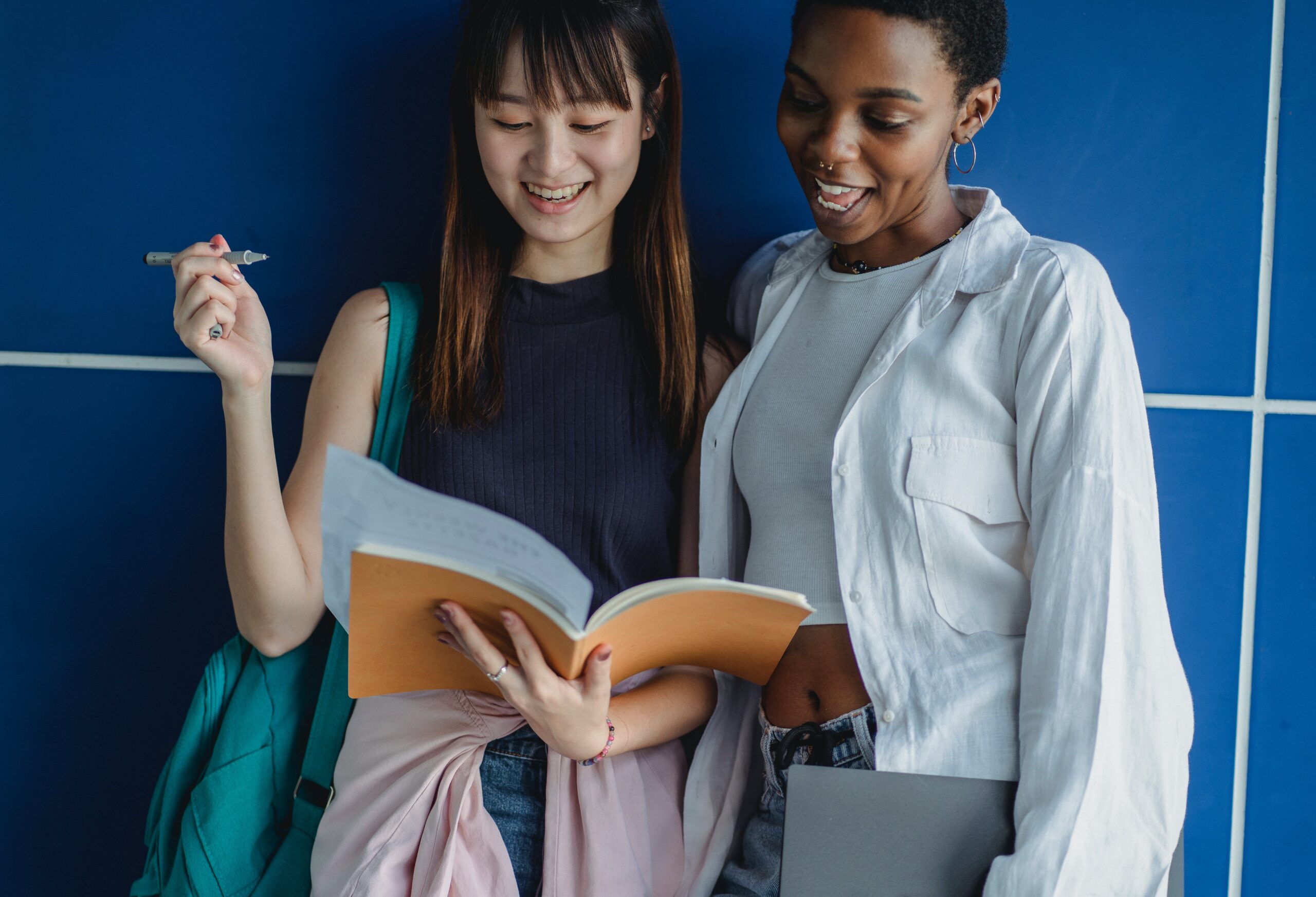     Two females looking at a booklet