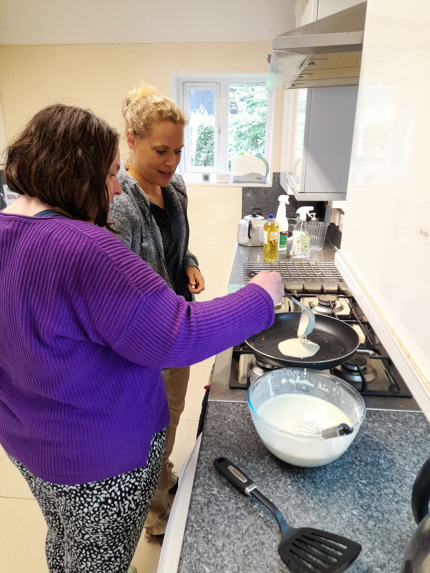     2 people cooking