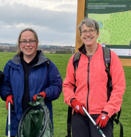 
    Two members of Lead Scotland Staff helping a befriendee with a litter pick