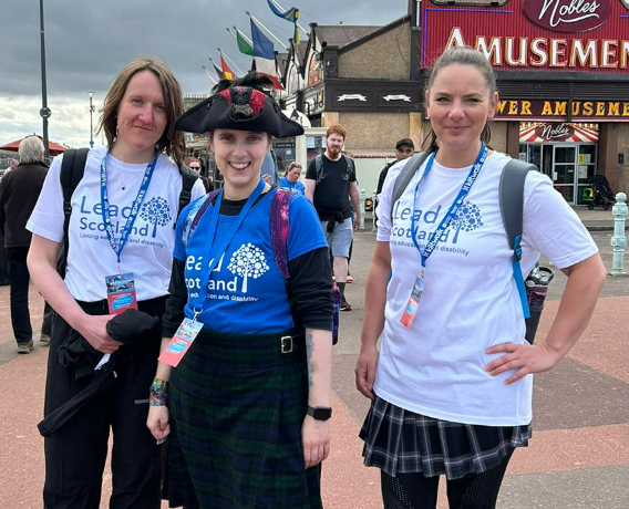 
    Three members of staff doing the kiltwalk